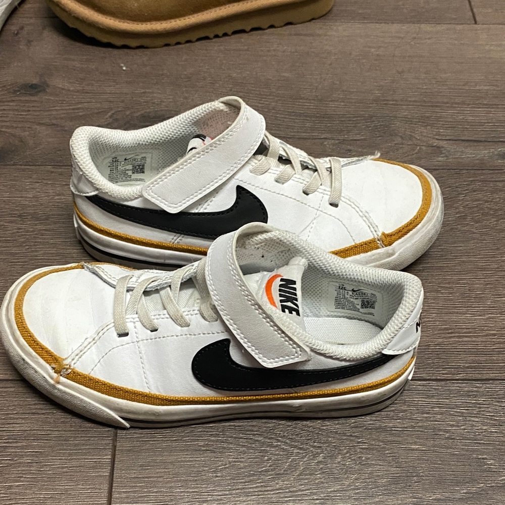 Nike Kids White, Black, and Gold Sneakers